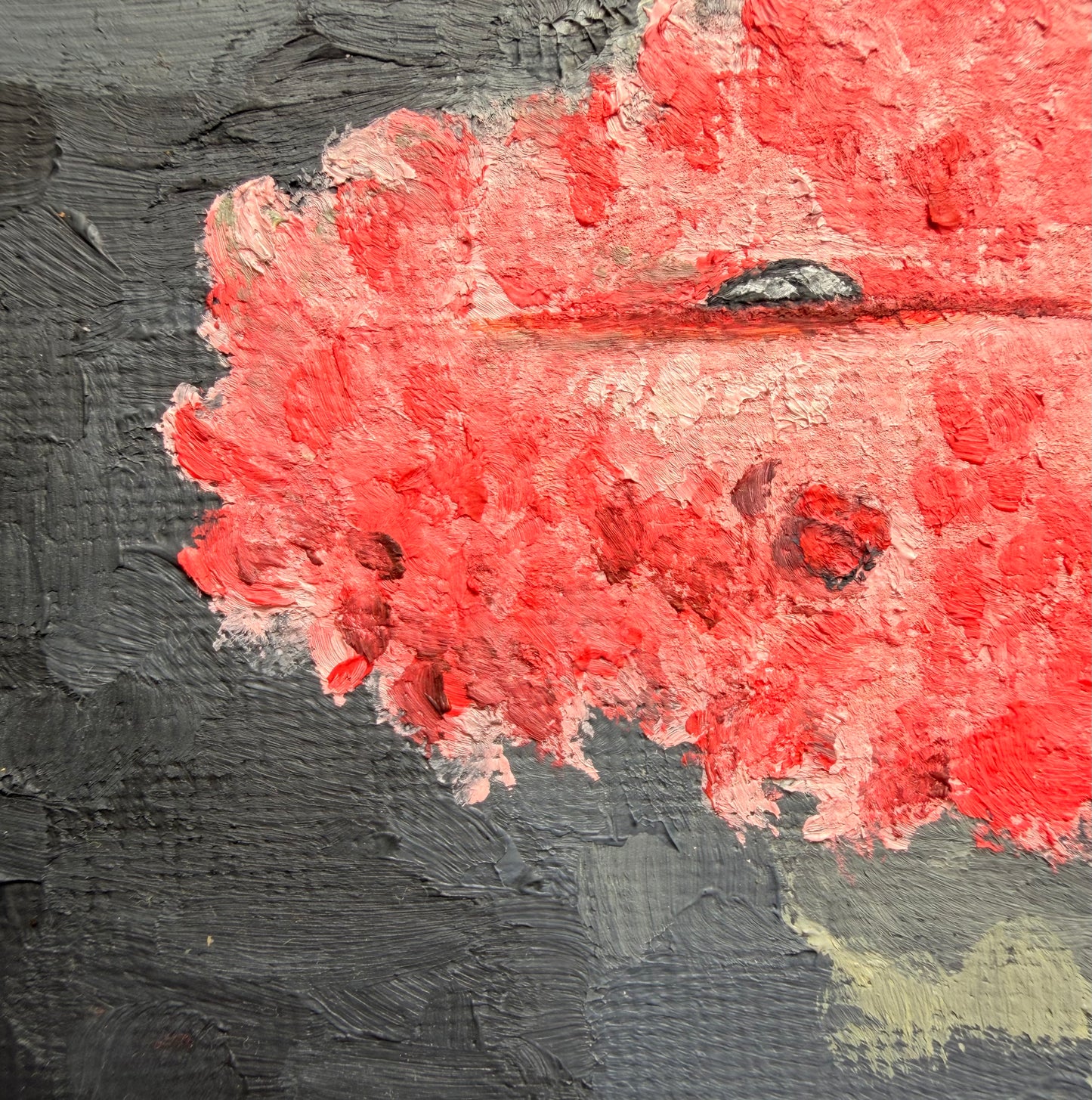 Angled view of "The Comfort Of Fear", showing its textured oil-painted surface and canvas depth.